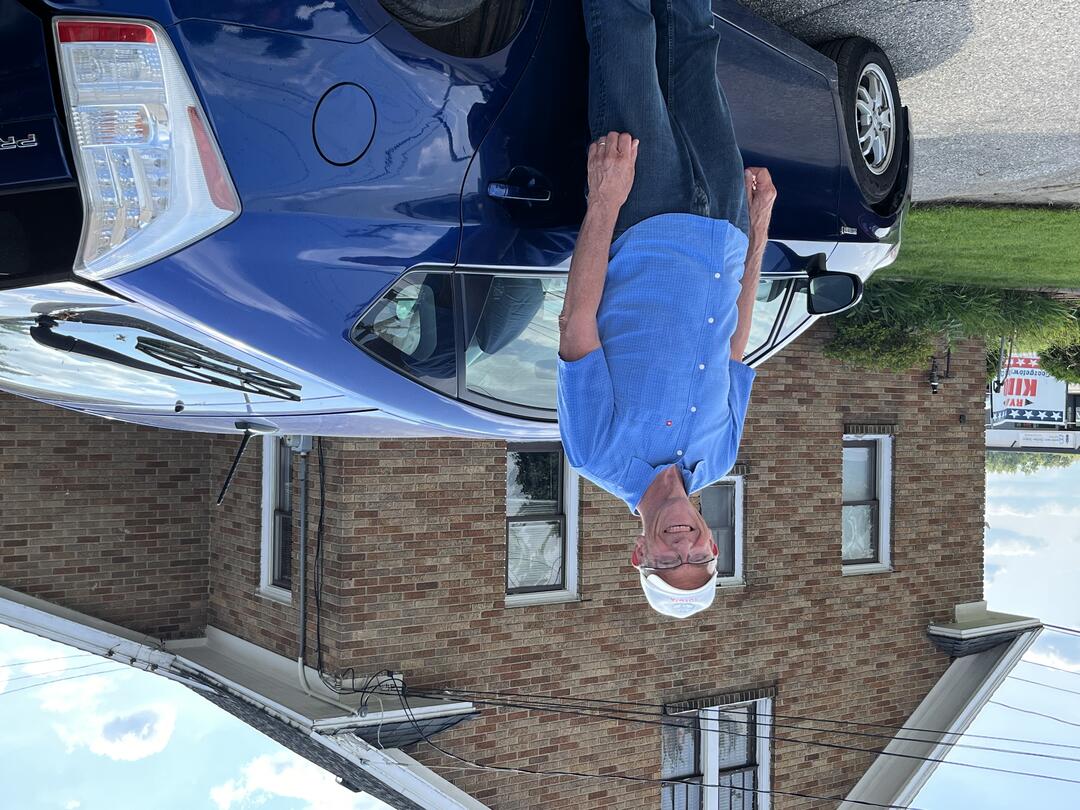 Dave with a blue Prius he restored